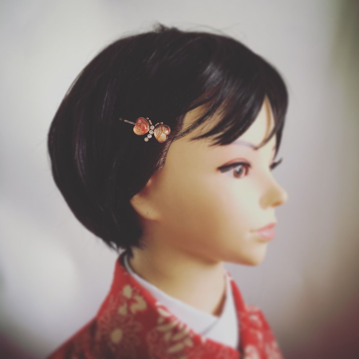 ヘアピン 蝶 渦巻き オレンジ ラインストーン